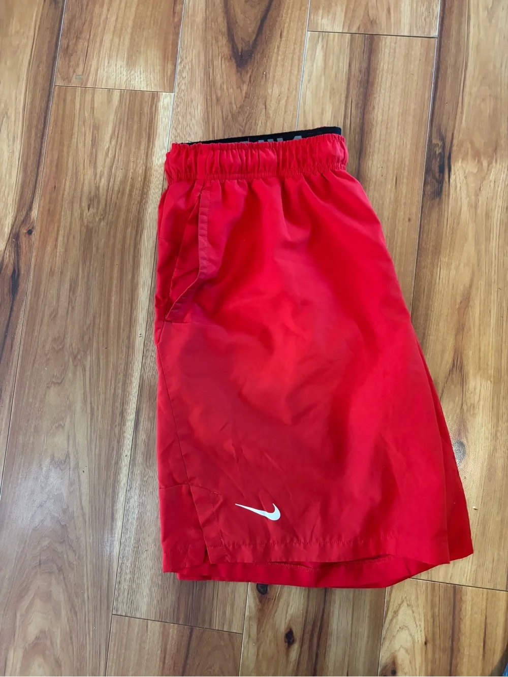 c-1 Nike Men’s Bright Red Athletic Shorts with White Swoosh.